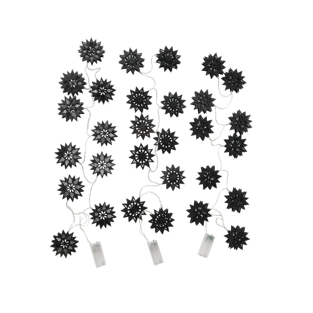 LED-lyslenke med stjernemotiv i sort tre, lagt ut flatt for visning.