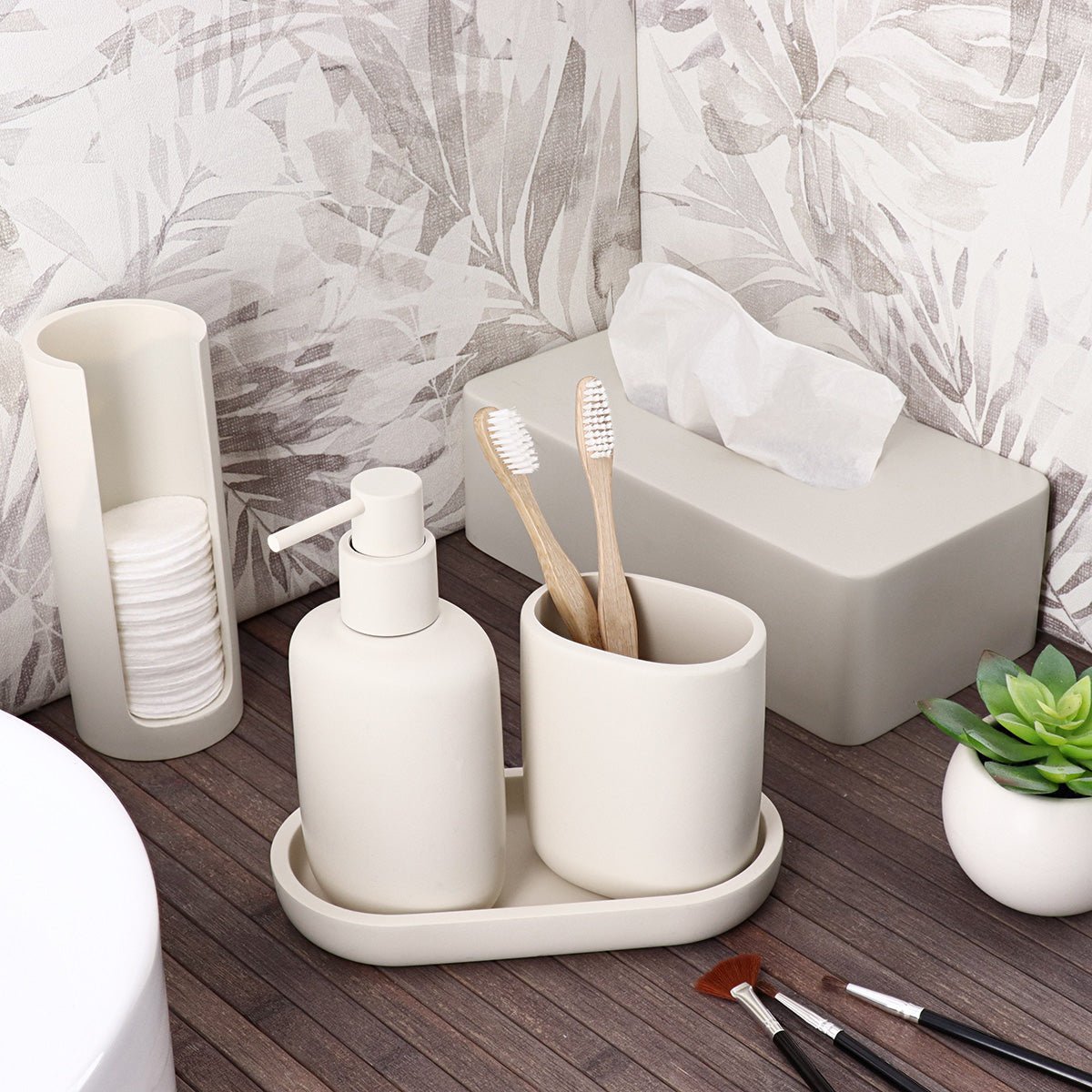 Smal beige dispenser for bomullspads sett fra siden