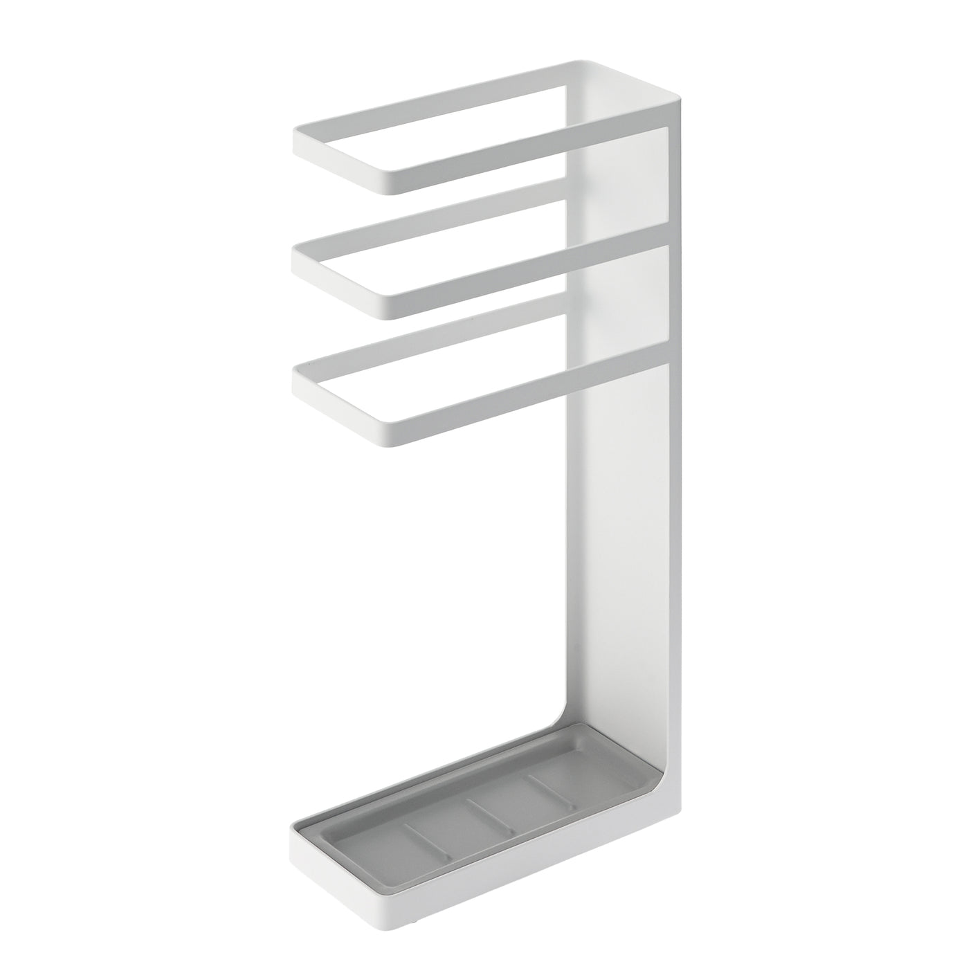 Paraply i svart metallstativ med dryppskål