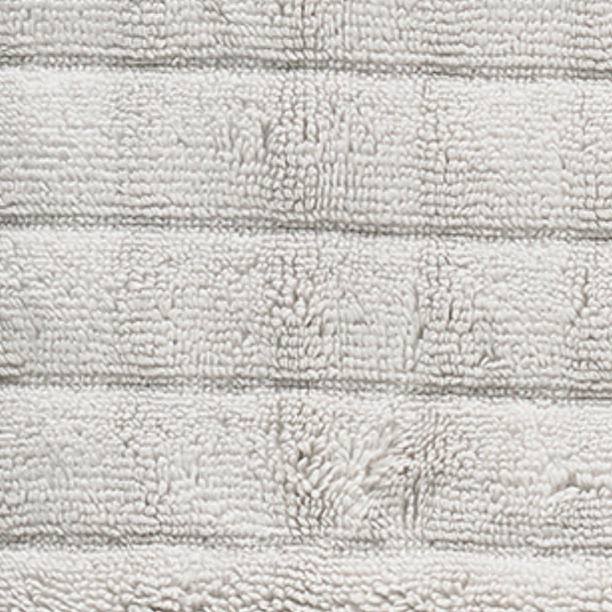 Grått håndkle i bomull med myk og absorberende kvalitet