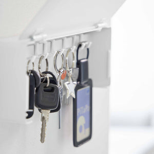 Veggmontert nøkkelskap i metall med fleksibel organisering av nøkler
