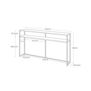 Smalt konsollbord i sort metall og tre brukt bak sofa.