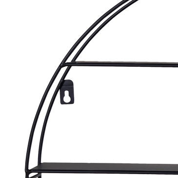 Rund vegghylle i sort brukt med plante og dekor