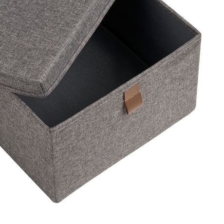 Noto tekstilboks med lokk åpnet