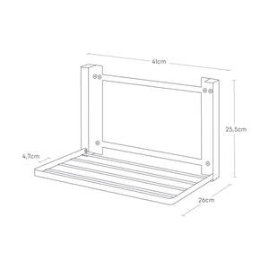 Detaljbilde av hvit vegghylle som brettes sammen.