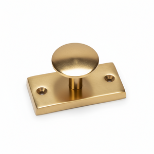 Enkel gullfarget metallknagg til vegg