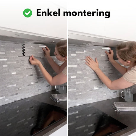 Veggfliser med strukturert steinmønster og metalliske innslag.