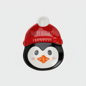 tallerken i keramikk med pingvinmotiv og rød nisselue