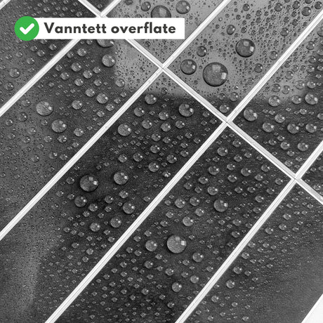 Nærbilde av Alma antrasitt fliser med realistisk marmorstruktur.