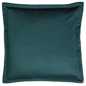 Petrolfarget putetrekk 50 x 50 cm i lys sofa med strikket pledd og lun innredning