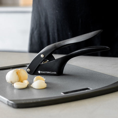 Ergonomisk vitlökspress med rustfria skärblad