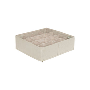 Beige skuffeorganiser sett ovenfra, med 16 separate rom.