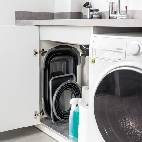 Pop up skittentøyskurv med buet form og praktiske håndtak